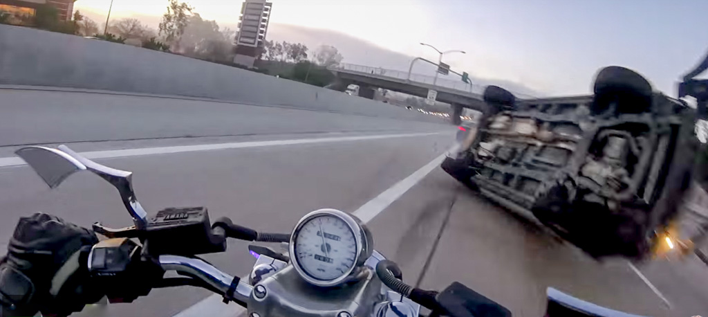 What Would A Biker Do When SUV Barrels Towards Him? - Video