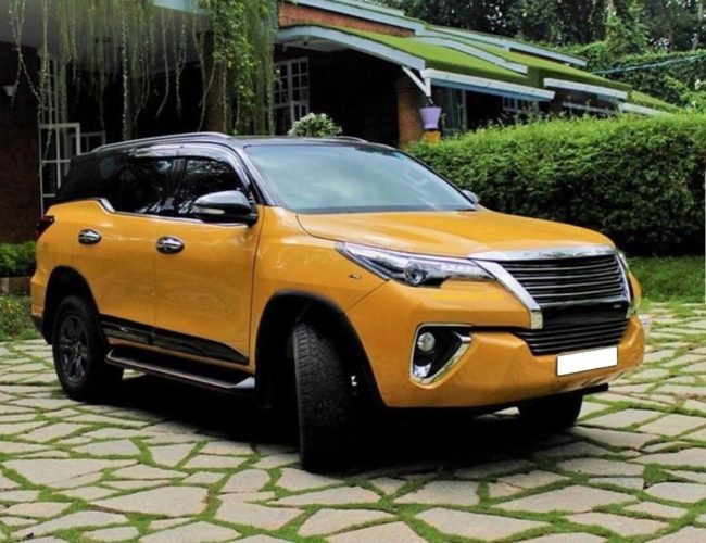 Modified Toyota Fortuner Yellow with Black roof