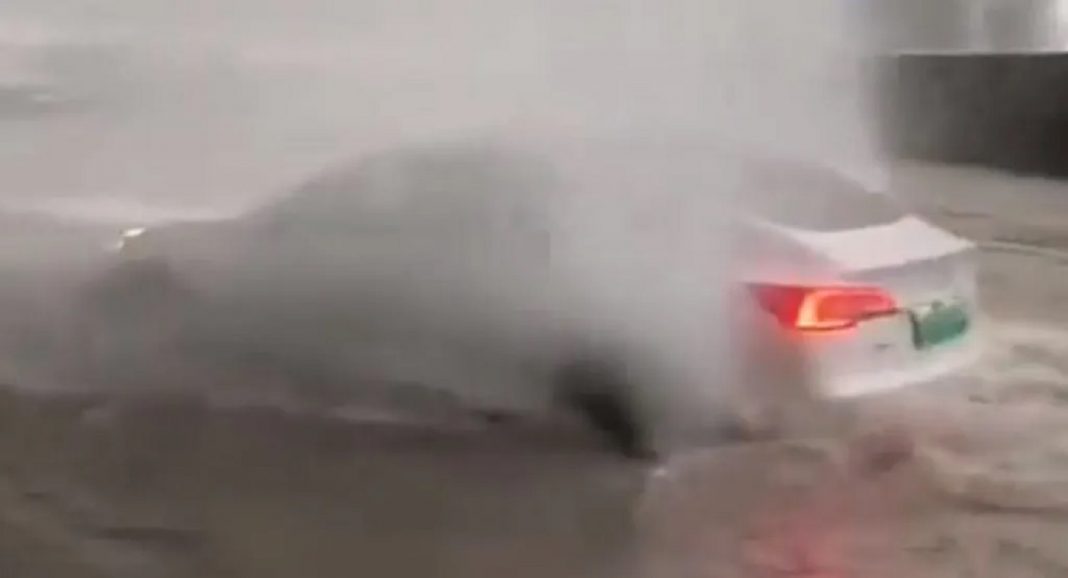 Tesla Model 3 Wading Flooded Street